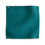 Wool trellis jacquard swatch pinned in all corners in teal