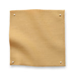Wool sateen swatch pinned in all corners in yellow