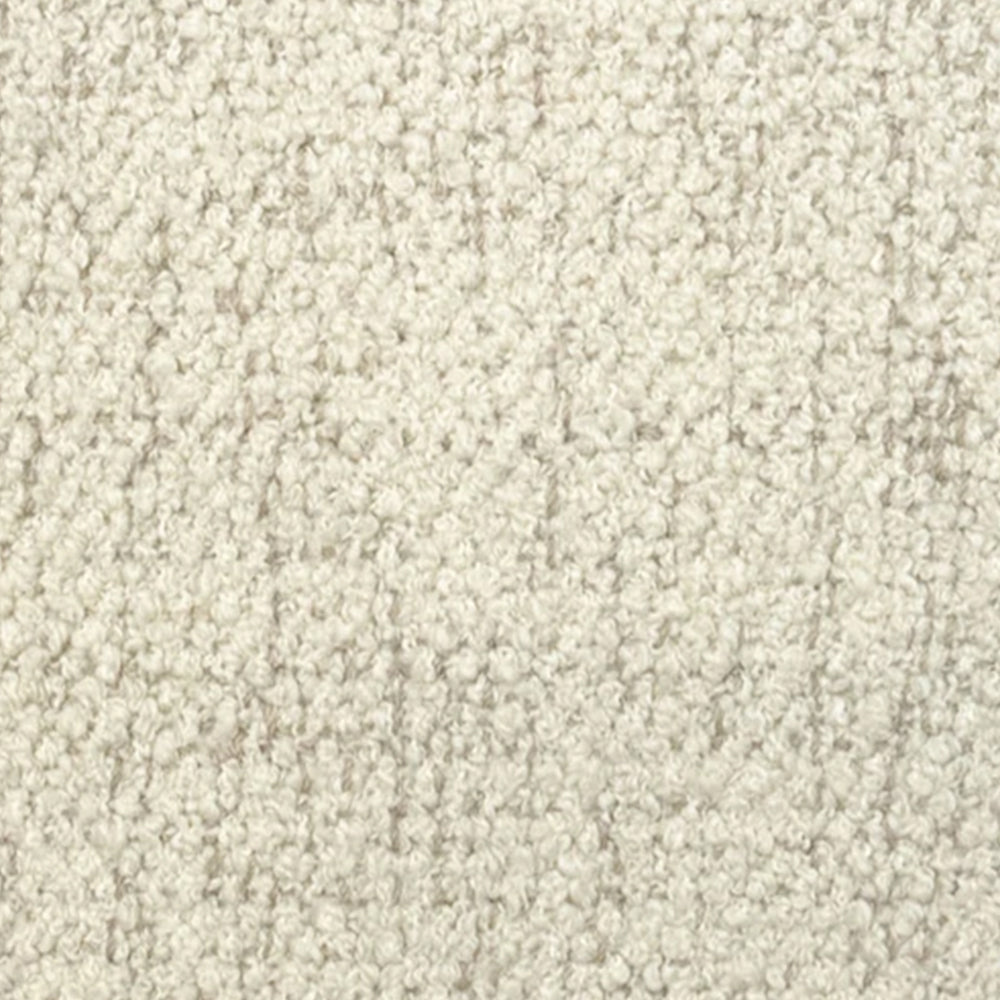 Broadloom carpet in cream bouclé with beige accents. 