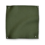 Wool sateen swatch pinned in all corners in moss green