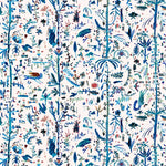 Detail of fabric in a playful plant, animal and insect print in shades of blue and green on a cream field.