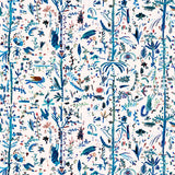 Detail of wallpaper in a playful plant, animal and insect print in shades of blue and green on a cream field.