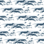 Detail of fabric in a running whippet print in navy on a white field.