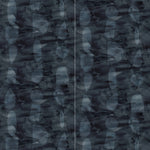 Panels of wallpaper in an abstract curvilinear pattern in shades of blues, navy and black.