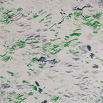 Detail of fabric in a painterly seaside print in gray, blue and green on a greige field.