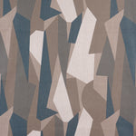 Detail of fabric in an abstract geometric print in brown, tan, blue and white.