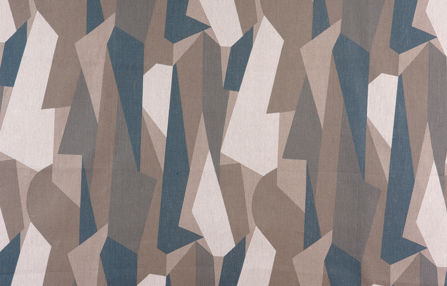Detail of fabric in an abstract geometric print in brown, tan, blue and white.