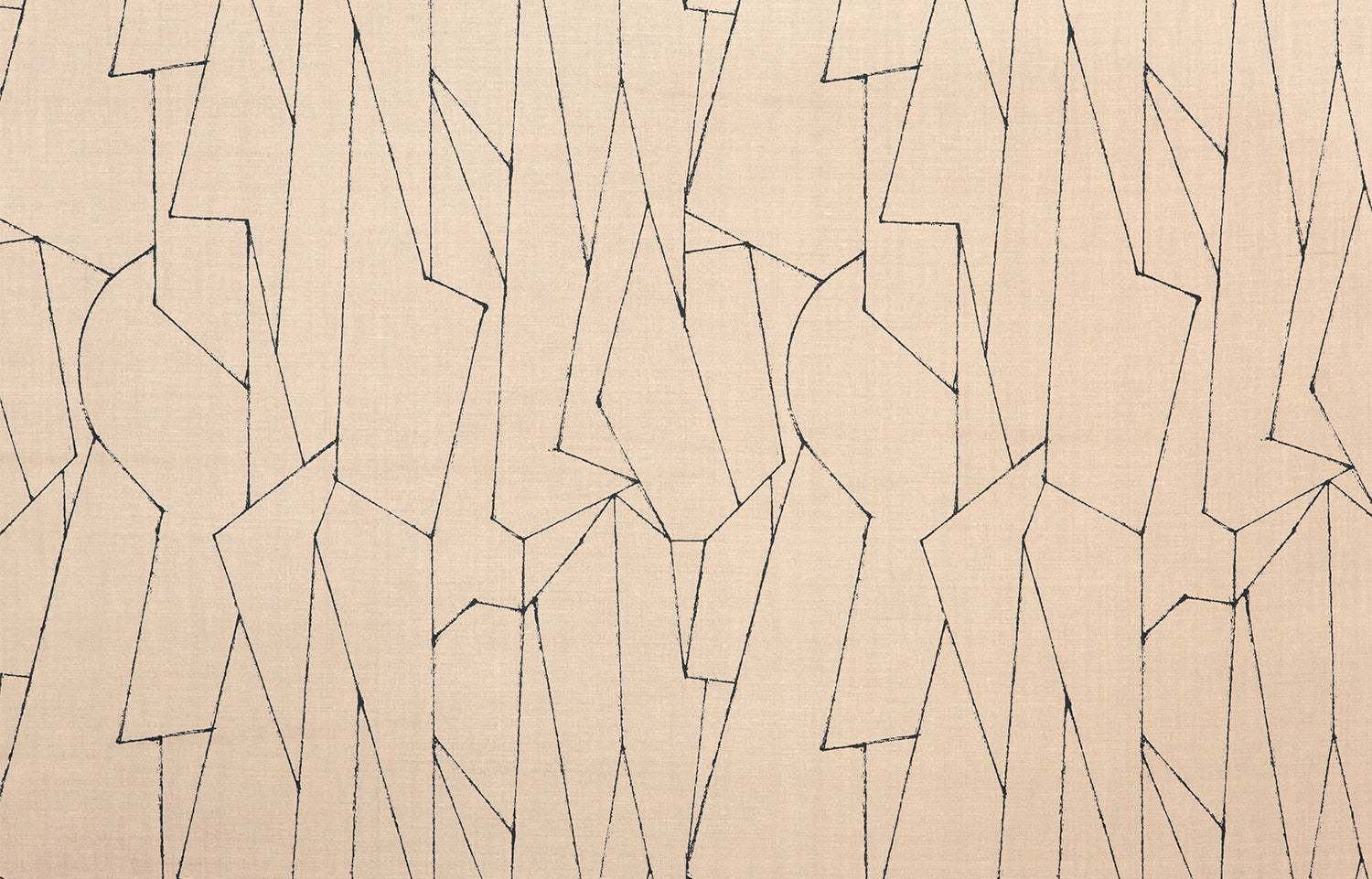Detail of fabric in an abstract lattice print in black on a tan field.