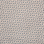 Detail of fabric in a dense geometric print in navy, tan and cream.