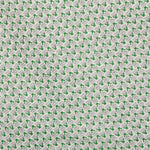 Detail of fabric in a dense geometric print in gray, green and cream.