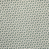 Detail of fabric in a dense geometric print in gray, dark green and cream.