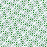 Detail of wallpaper in a dense geometric print in green, blue-gray and cream.