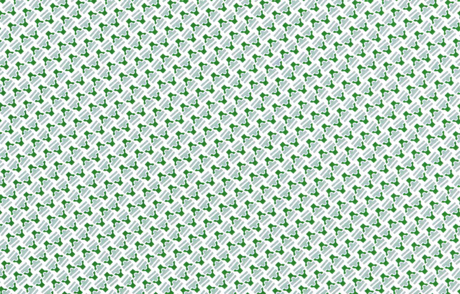 Detail of wallpaper in a dense geometric print in green, blue-gray and cream.