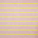Detail of fabric in a horizontal striped print in yellow and white on a pink field.