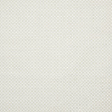 Detail of fabric in a small-scale geometric grid print in white on a cream field.