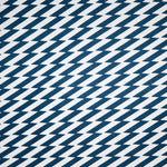 Detail of fabric in a zigzag stripe print in navy on a white field.