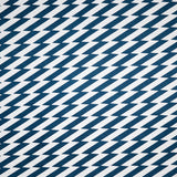 Detail of fabric in a zigzag stripe print in navy on a white field.