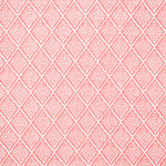 Detail of fabric in a diamond lattice print in white on a pink field.