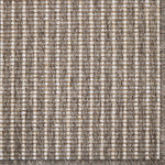 Textured rug with a striped pattern in brown and beige tones