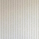 Detail of wallpaper in a repeating striped circular print in gray on a light gray field.