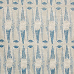 Detail of fabric in an abstract geometric print in tan and navy.
