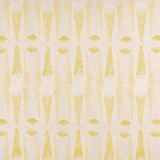 Detail of fabric in an abstract geometric print in yellow and white.