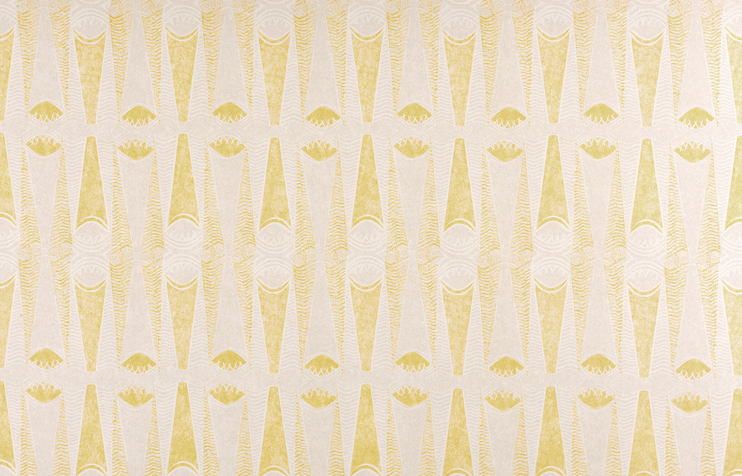 Detail of fabric in an abstract geometric print in yellow and white.