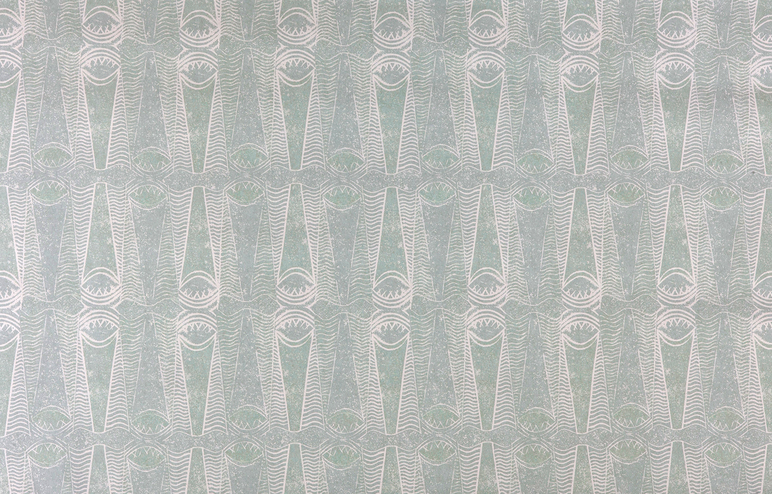 Detail of wallpaper in an abstract geometric print in light green and gray.