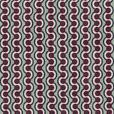 Detail of fabric in a playful curving stripe print in red, white and green on a light green field.