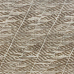 Detail of fabric in a textural geometric stripe in shades of brown.