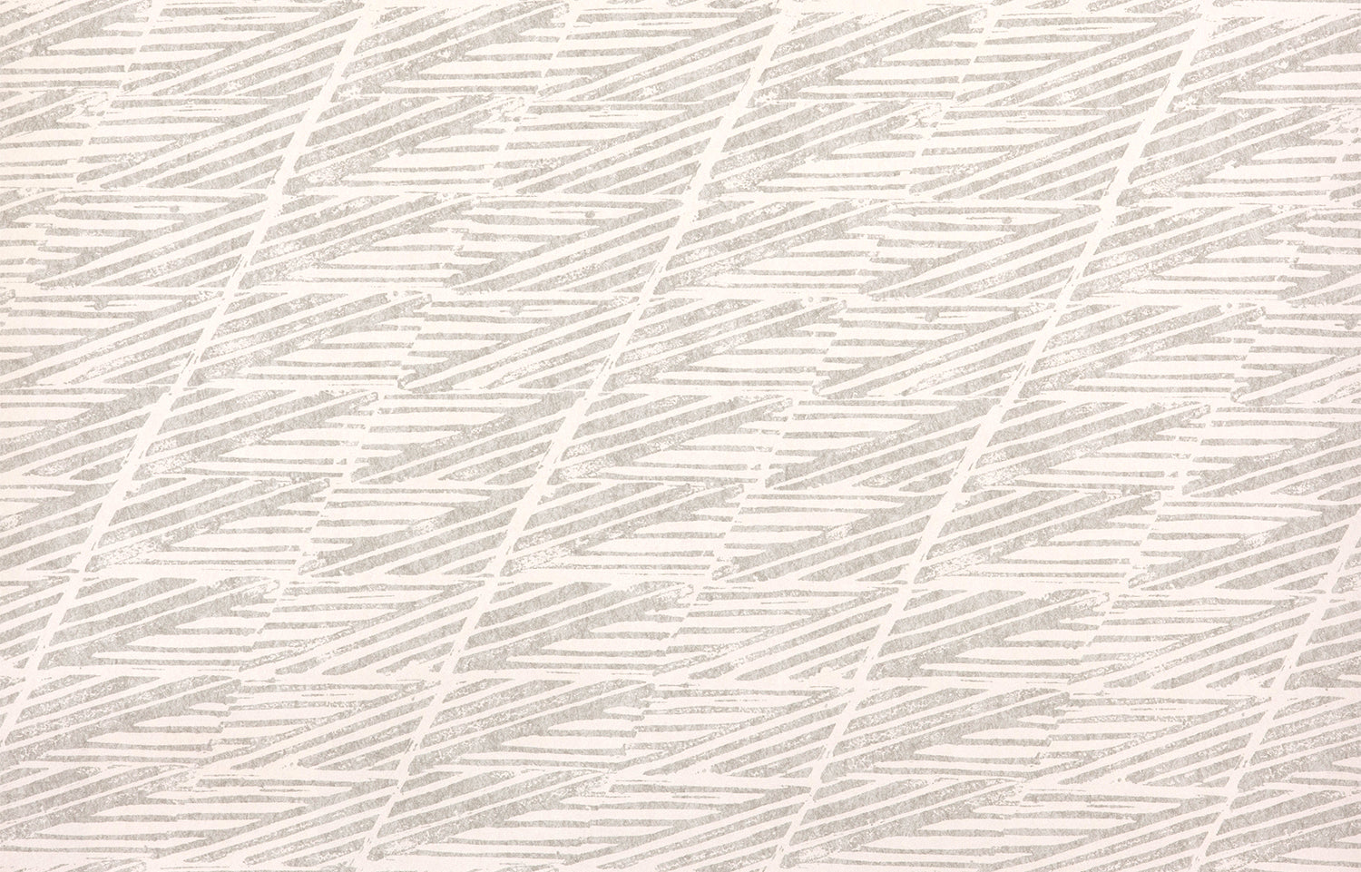 Detail of wallpaper in a textural geometric stripe in gray on a white field.