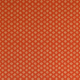 Detail of wallpaper in a minimalist quatrefoil pattern in yellow on a red field.