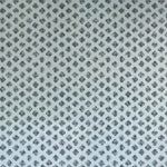 Detail of wallpaper in a minimalist quatrefoil pattern in navy on a light blue field.