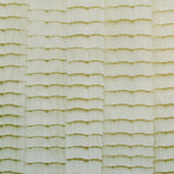 Detail of wallpaper in an abstract textural pattern in metallic green and greige.