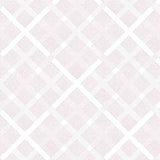 Detail of wallpaper in a dotted plaid pattern in pink on a white field.
