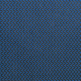 Detail of fabric in a playful curving stripe in gray on a navy field.