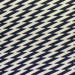 Detail of fabric in a zigzag stripe print in black on a cream field.