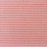 Detail of fabric in a matchstick grid print in red on a white field.