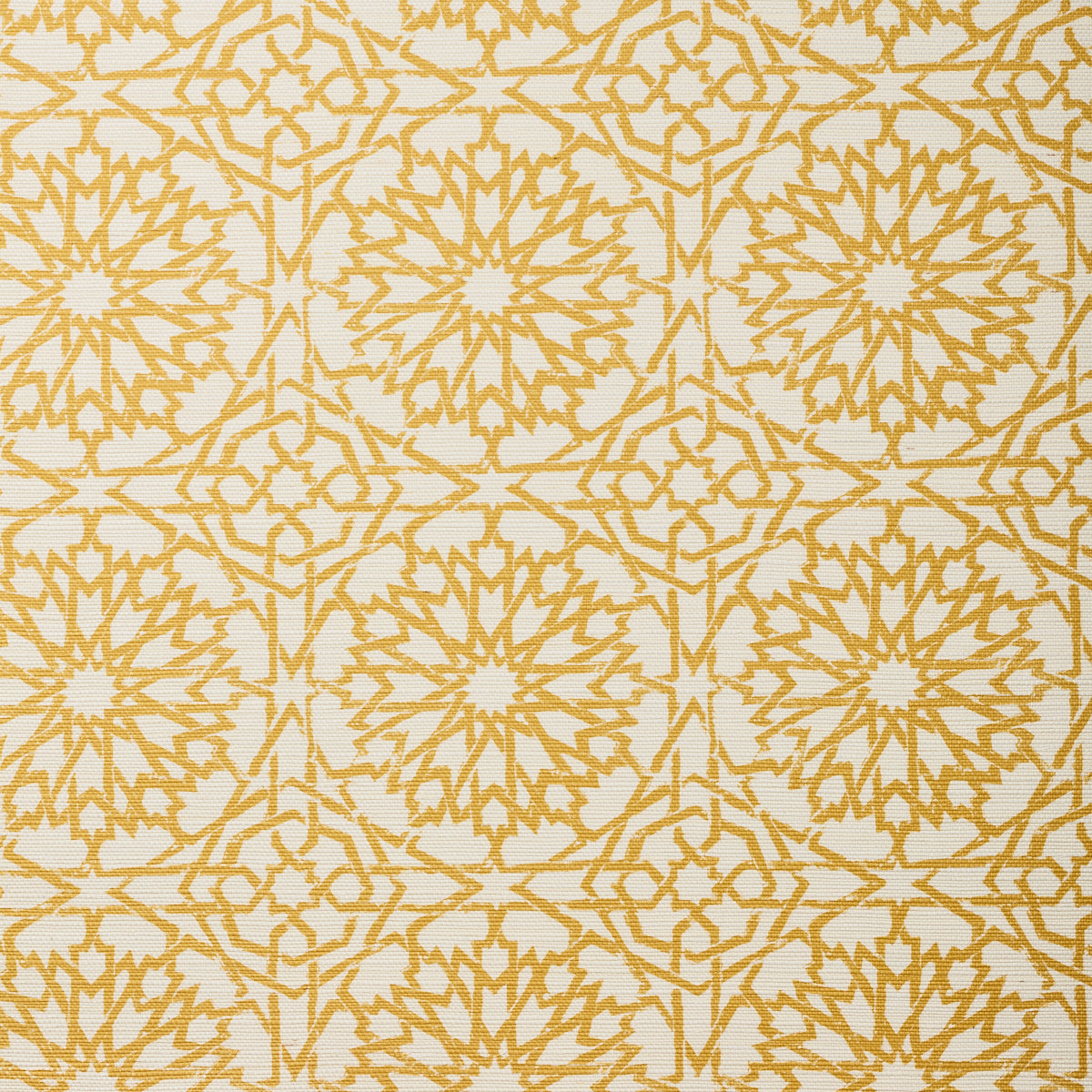 Detail of fabric in a small-scale lattice print in yellow on a cream field.