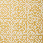 Detail of fabric in a small-scale lattice print in yellow on a cream field.