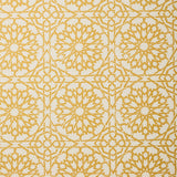 Detail of fabric in a small-scale lattice print in yellow on a cream field.