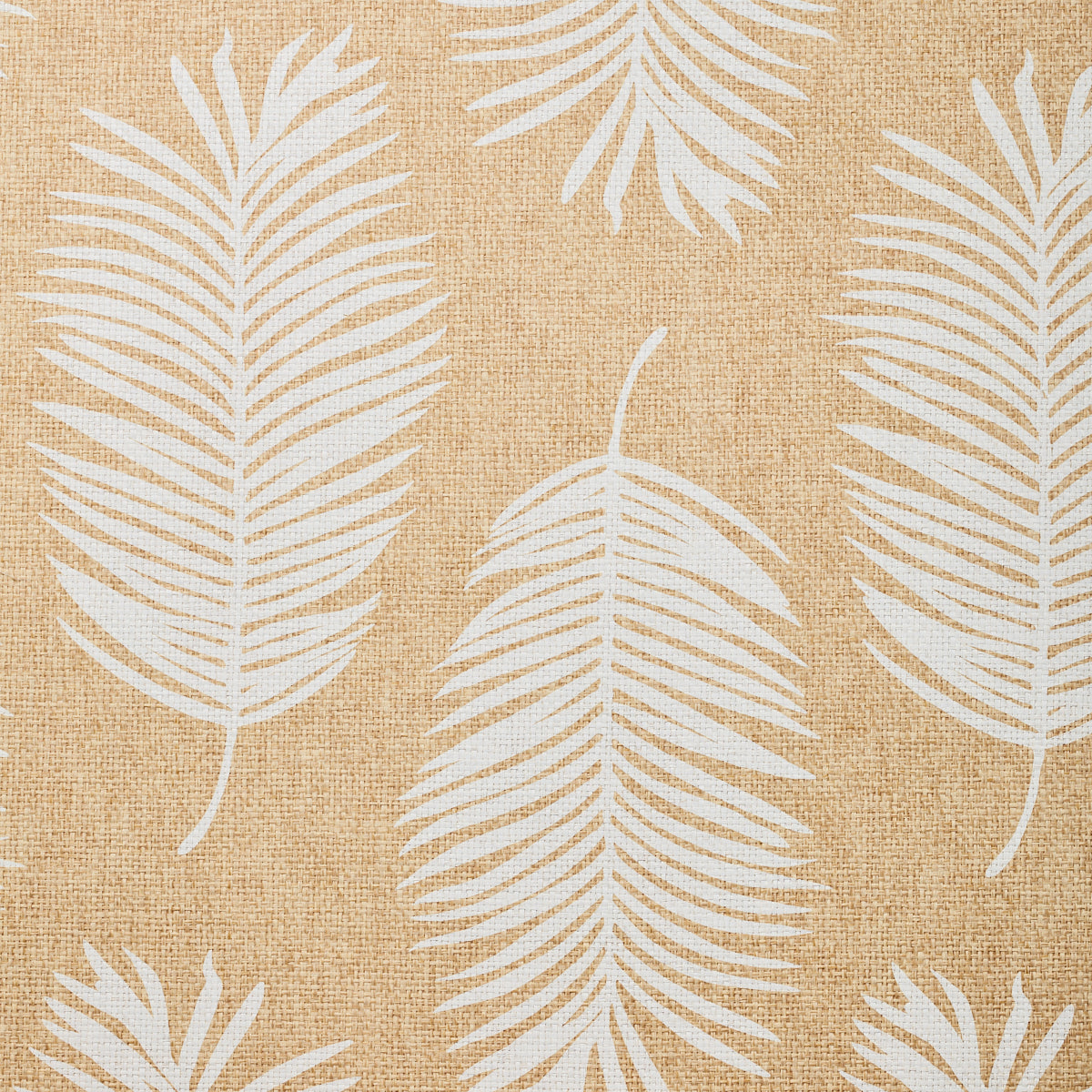 Detail of fabric in a large-scale leaf print in white on a tan field.