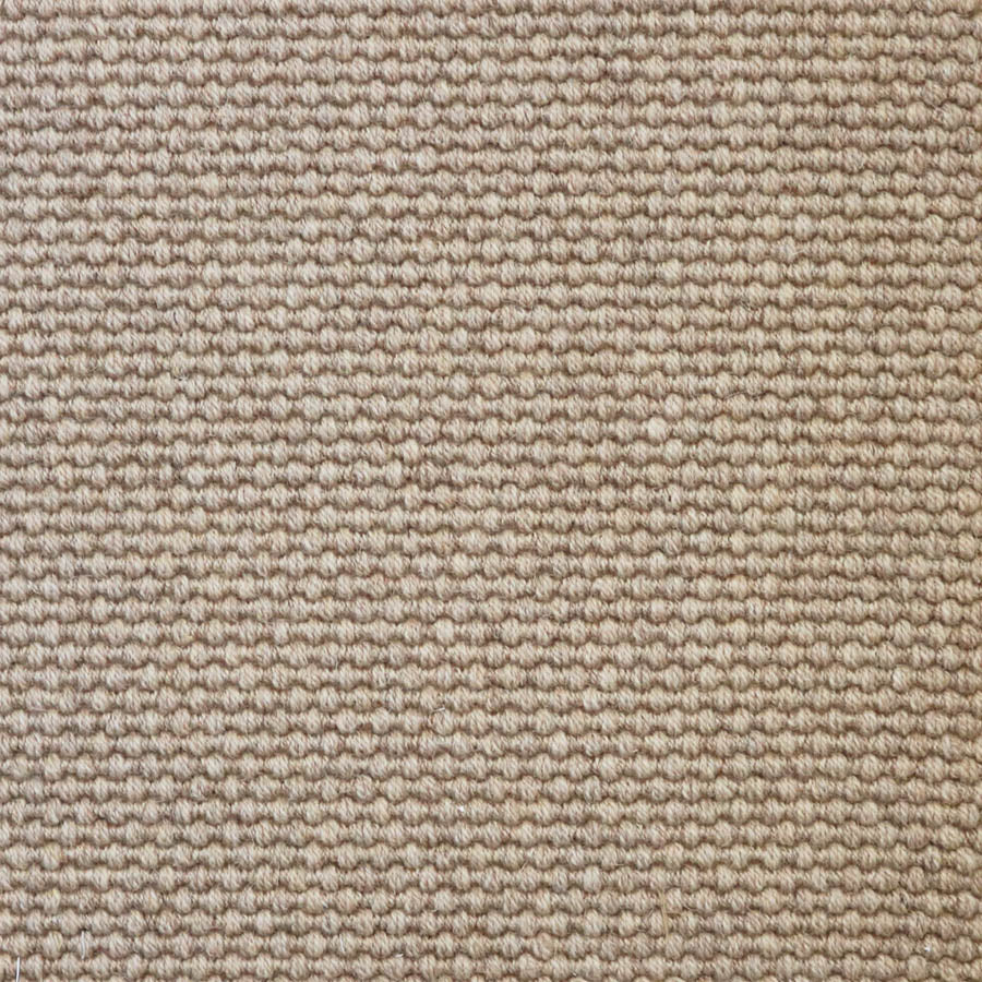Broadloom carpet swatch in a solid pattern light tan color