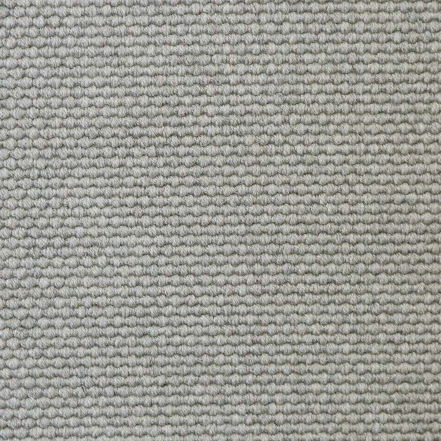 Broadloom carpet swatch in a solid pattern light grey color