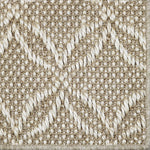 Close-up of a broadloom carpet in a lattice design in beige and white 