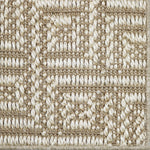 Close-up of a key pattern carpet in beige and white