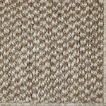 Close-up of a textured sisal carpet in ecru.