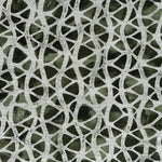 Detail of wallpaper in an abstract grid print in gray on a mottled dark green field.