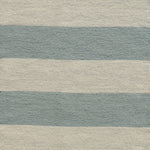 Handwoven rug with wide stripes in cream and light blue. 