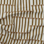 Gently draped printed linen in a broken stripe design in brown, blush pink, ecru and cream. 